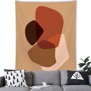 Detail of Nordic Morandi geometric tapestry hanging over a grey sofa in a modern room