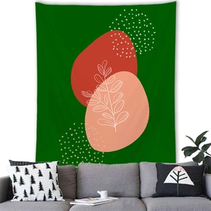 Modern Nordic tapestry with abstract color blocks and white botanical lines on a green wall