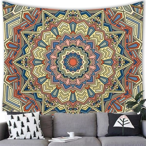 Mandala wall tapestry with geometric patterns in blue and yellow above a sofa