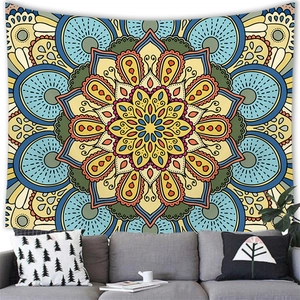 Detailed close-up of colorful mandala wall tapestry hanging above a modern living room sofa