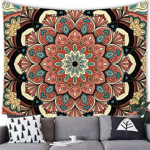 Detail of bohemian mandala tapestry featuring intricate geometric patterns on a living room wall