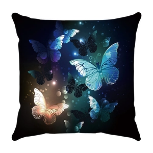 Detailed close-up of vibrant glowing butterflies on a black square throw pillow case