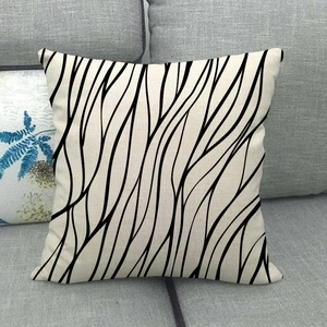 Minimalist black abstract wave pattern linen throw pillow cover on grey sofa