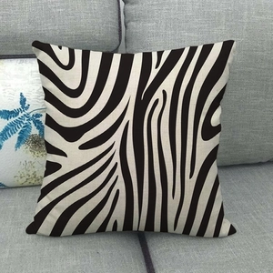 Detailed view of square linen pillowcase featuring a modern black and white zebra pattern