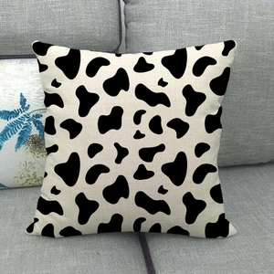 Close-up of the black and white cow print texture on the linen decorative pillowcase