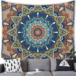 Mandala tapestry with radial patterns hung above a sofa in a modern living room
