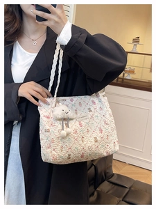 Quilted floral tote bag with cartoon bear pattern and white cloud plush charm detail