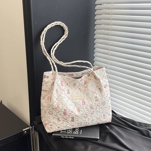 Fashionable white quilted tote bag with colorful cartoon bear and floral patterns