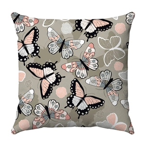 Detail of floral butterfly pattern on soft plush square decorative pillow cover