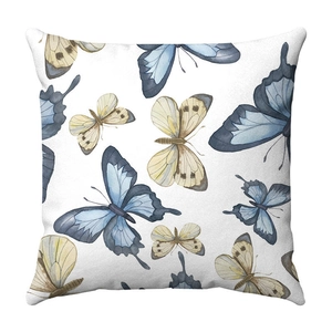 Square throw pillow featuring watercolor blue butterflies printed on white plush fabric