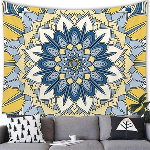 Blue and yellow mandala tapestry hanging above a grey sofa for wall decoration