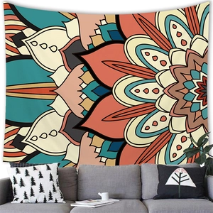 Detailed view of bohemian mandala tapestry hanging above a sofa in a modern living room