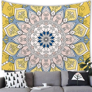 Detailed close-up of mandala wall tapestry with floral geometric patterns on white wall