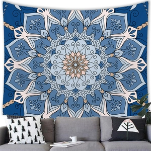 Blue mandala tapestry hanging above a modern sofa for minimalist home wall decor