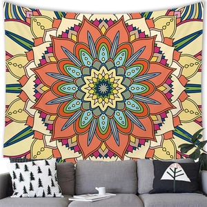 Colorful mandala wall tapestry hanging above a gray sofa in a modern minimalist living room