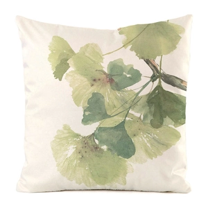 Detail of square pillowcase featuring watercolor green ginkgo leaves on ivory fabric