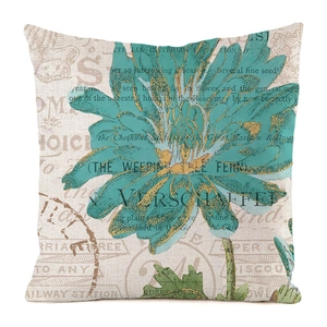 Detailed macro view of retro turquoise chrysanthemum print on linen throw pillow cover