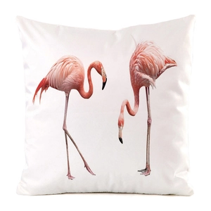 Detail of flamingo print pillowcase in faux silk fabric with vibrant pink bird patterns