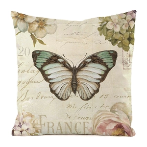 Detail des Vintage-Kissenbezugs mit Schmetterlingsdruck und France-Schriftzug