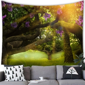 Fantasy forest wall tapestry with magical sunlight and purple flowers over grey sofa