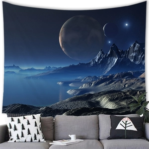 Detail of sci-fi planet and mountain tapestry hanging above a modern living room sofa