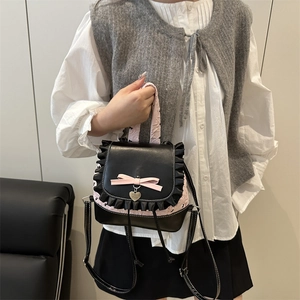 Sweet pink and black lace backpack with heart pendant and ribbon details for girls