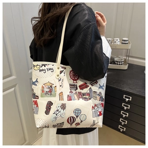 Detail of the colorful Hong Kong city illustration printed on a white tote bag