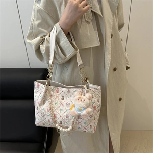 Floral tote bag with cute bear print and pearl chain featuring a plush bear charm