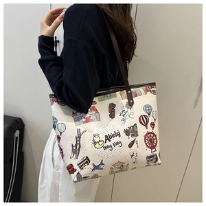 Detail view of large tote bag with colorful Hong Kong themed cartoon illustrations