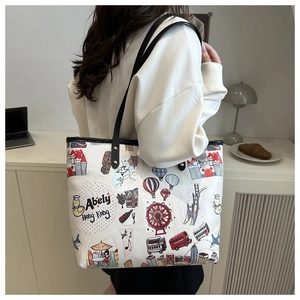 Close-up of Hong Kong graffiti print white tote bag with black leather shoulder straps