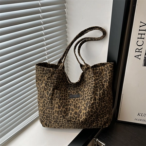 Large capacity leopard print canvas tote bag with dual handles for shoulder and hand carry