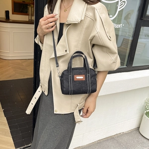 Stylish black denim crossbody pillow bag with contrast stitching for women fashion