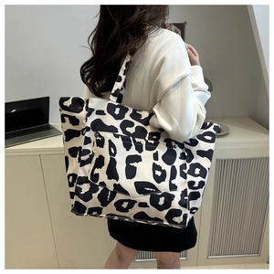 Close-up of leopard print nylon tote bag with large front pocket for daily commute
