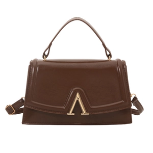 Brown glossy leather crossbody square bag with a prominent gold V-shaped metal clasp