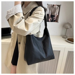 Detail of black woven texture Hobo bag featuring premium cross-weave craftsmanship for women