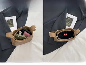 Détail de l'intérieur du sac seau marron montrant les compartiments et la poche zippée