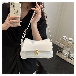 Close-up of a white glossy leather shoulder bag featuring a gold metal buckle lock