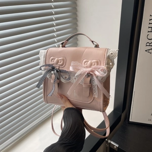 Pink PU leather backpack with white lace and checkered bows in a minimalist aesthetic