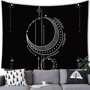 Constellation wall tapestry with celestial moon patterns displayed above a sofa