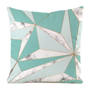 Close-up of geometric triangle pattern with marble textures and gold lines on a cushion cover