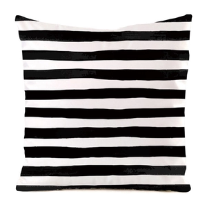 Detail shot of black and white striped pillow case with artistic watercolor texture
