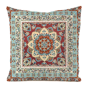 Close-up of Persian mandala pattern on square cushion cover with ethnic floral textures