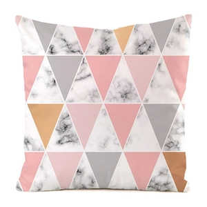 Detail of square pillowcase featuring geometric triangles and marble texture patterns