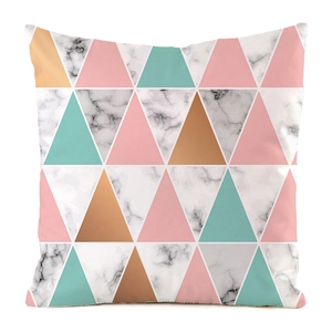 Detailed close-up of geometric triangle patterns and marble texture on silk cushion cover