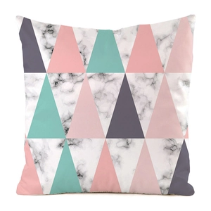 Detail of square pillowcase featuring colorful geometric triangles and marble textures