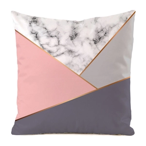 Detail of geometric pillowcase with marble texture, pink and purple tones with gold lines