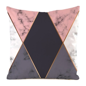 Macro detail of geometric marble pattern pillow cover with gold lines and pink grey tiles
