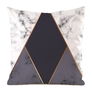 Detail of geometric marble pattern cushion cover with rose gold metallic divider lines