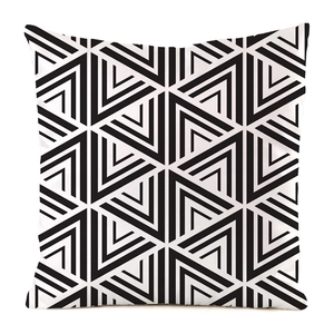 Detail of the geometric triangular pattern on a black and white faux silk pillow cover