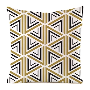 Close-up of geometric triangle pattern on luxury faux silk cushion cover in gold and black